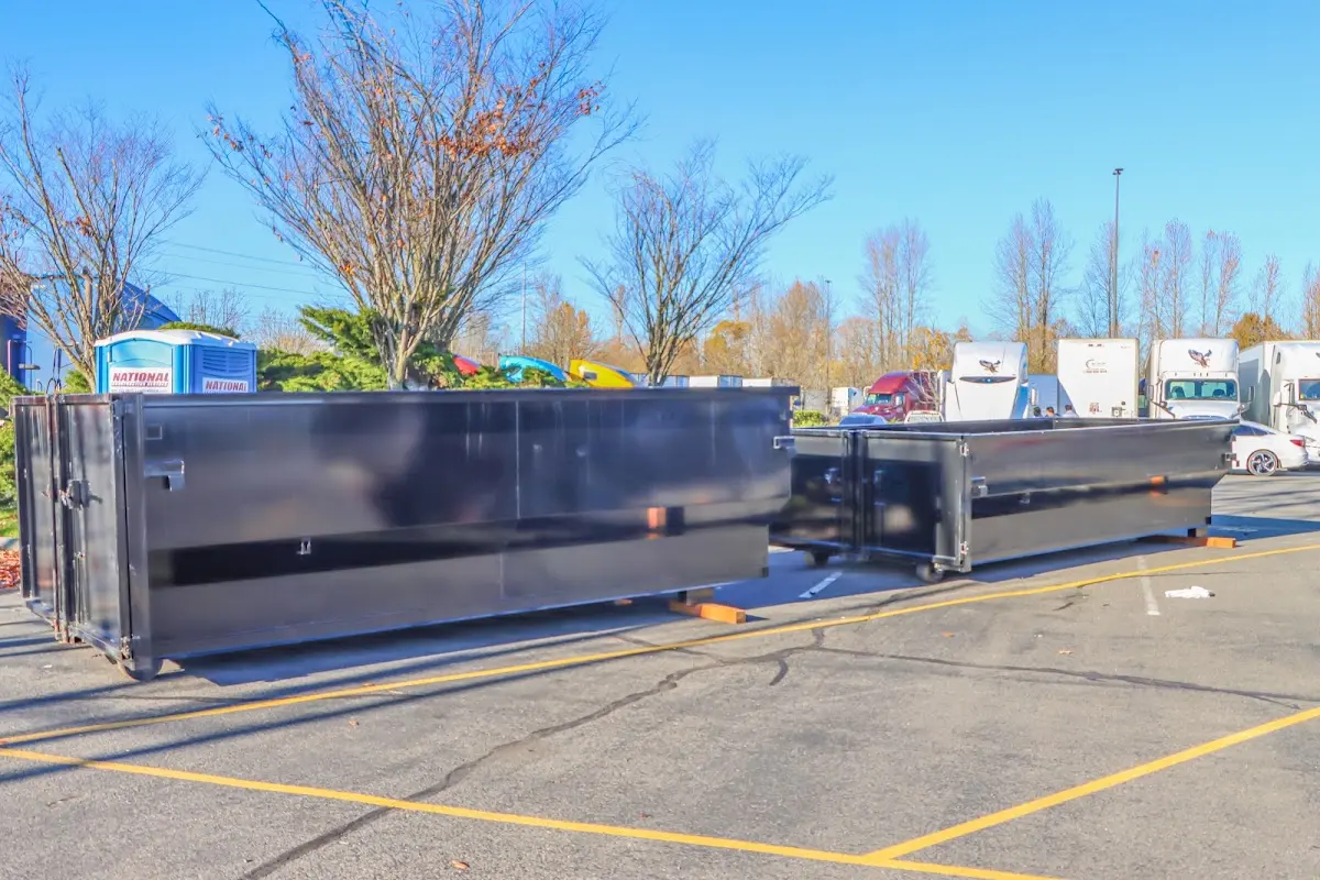 Professional dumpster rental service with roll-off container on residential driveway in Green Cove Springs